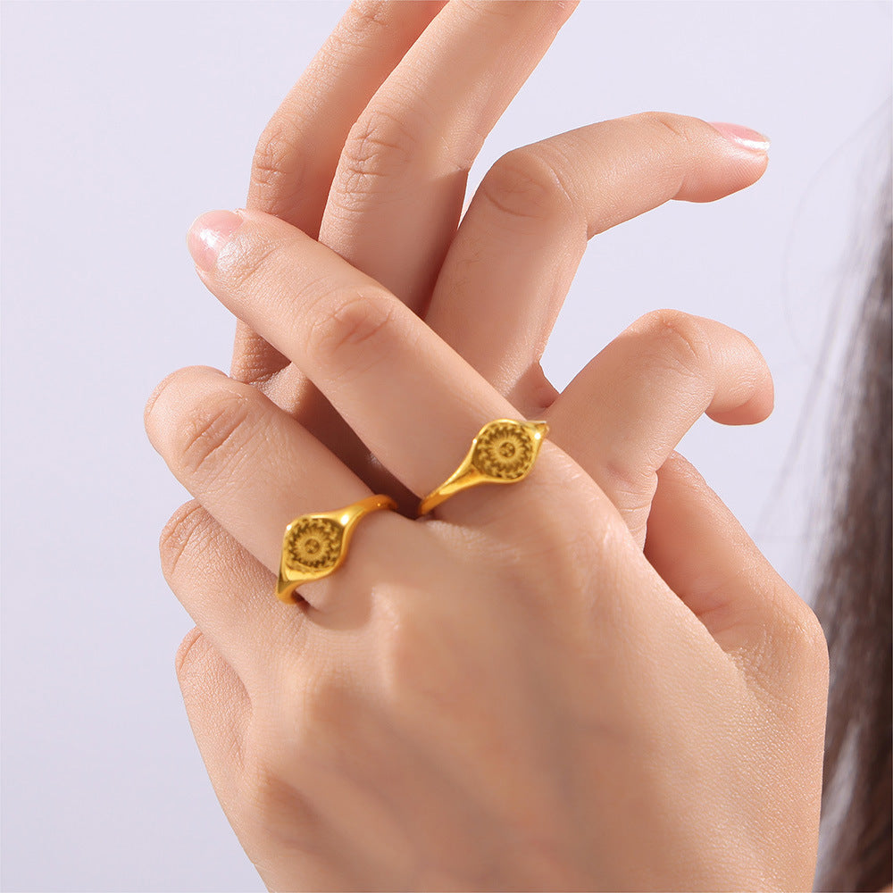 Fashion personality niche cold wind jewelry engraved wreath surrounding the sun design titanium steel gold-plated ring pp