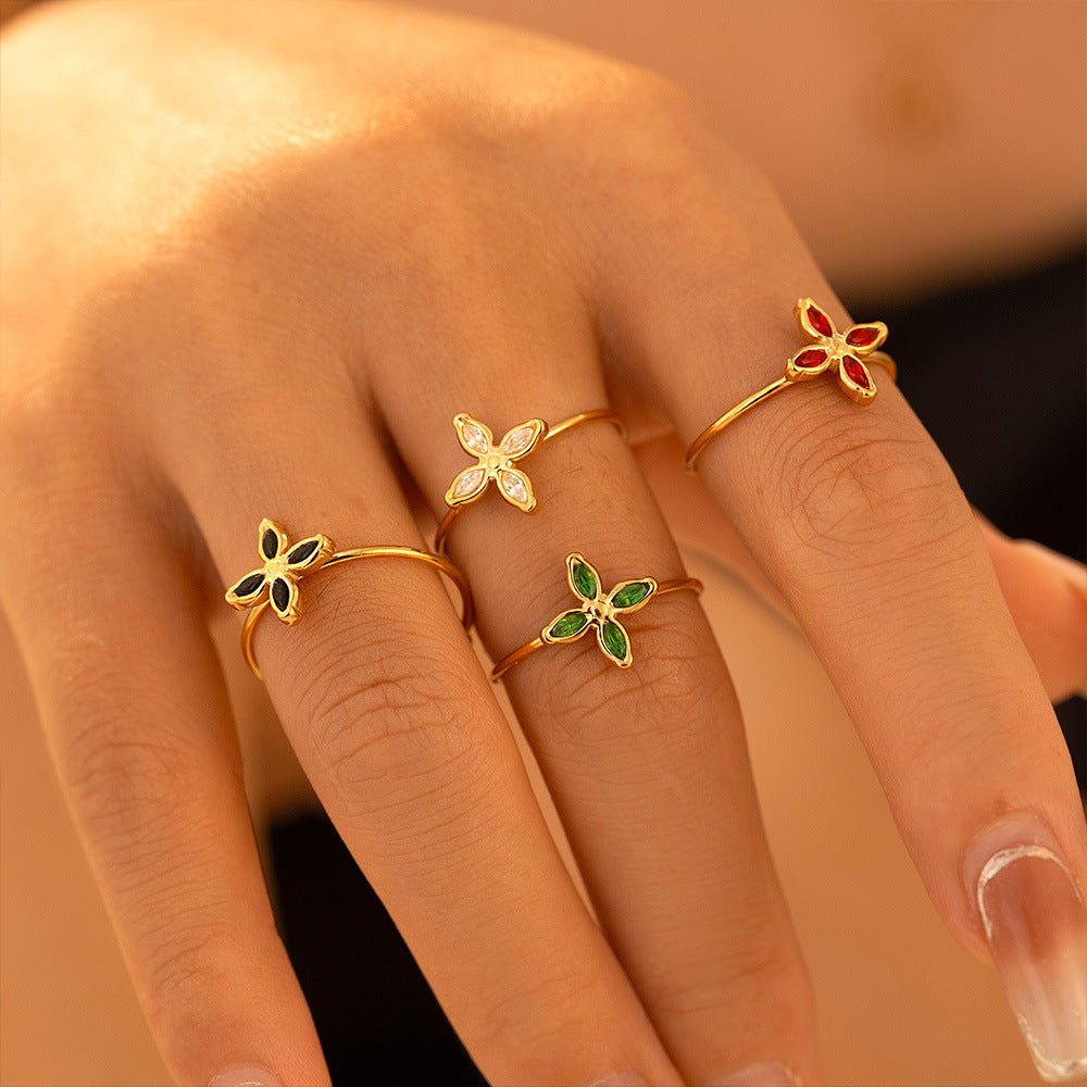 Niche four-petaled flower inlaid zircon pendant, collarbone necklace, open ring, titanium steel plated 18k real gold set, women's 99.