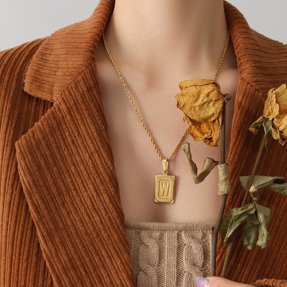 Cold wind niche light luxury retro high-end sense tag necklace titanium steel plated 18K real gold women's jewelry