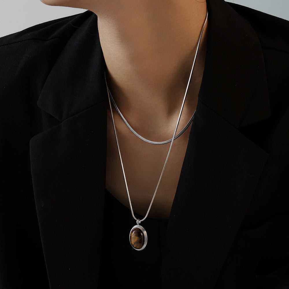 Autumn and winter stacked wearing Maillard style oval tiger's eye stone pendant necklace light luxury stainless steel non-fading neck chain