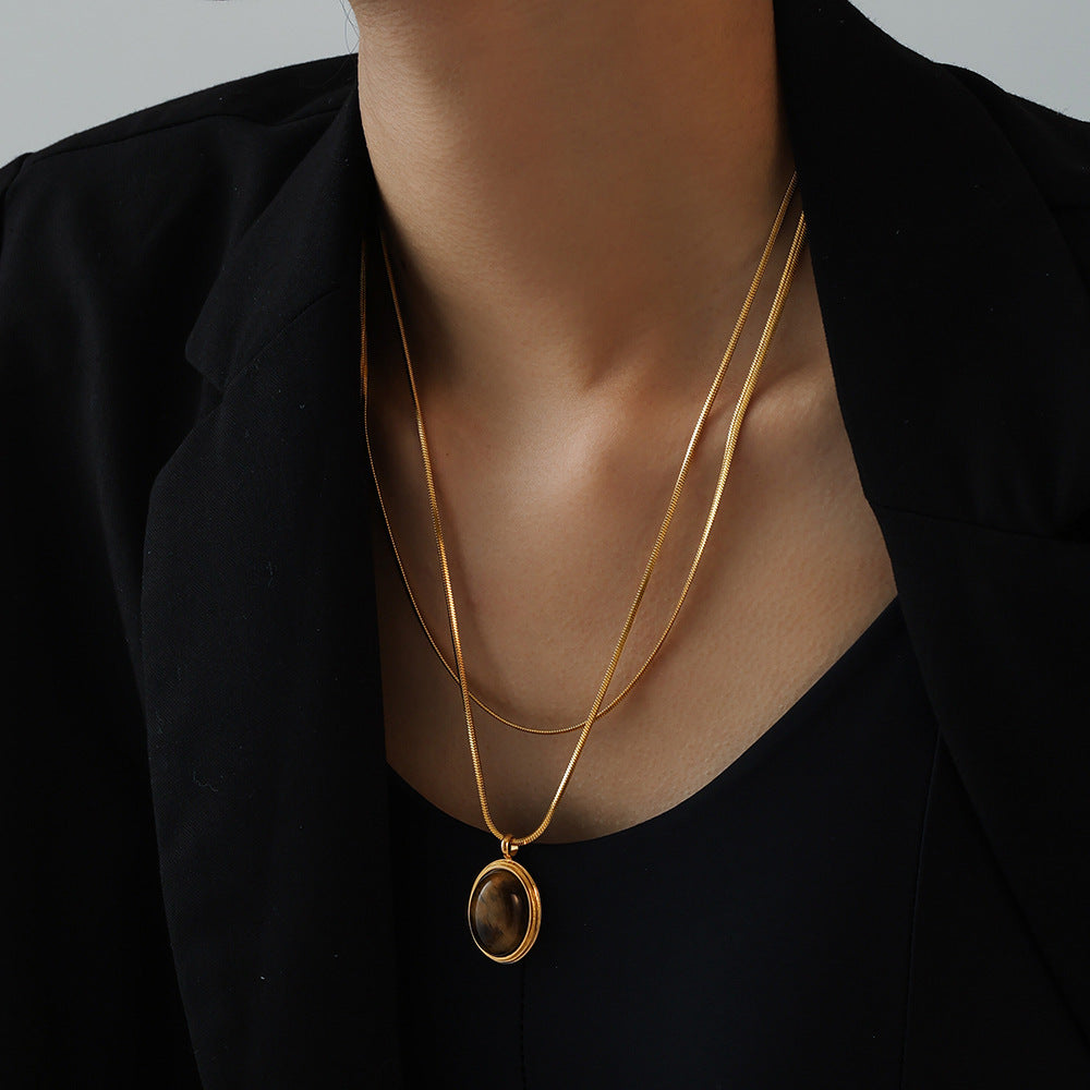 Autumn and winter stacked wearing Maillard style oval tiger's eye stone pendant necklace light luxury stainless steel non-fading neck chain