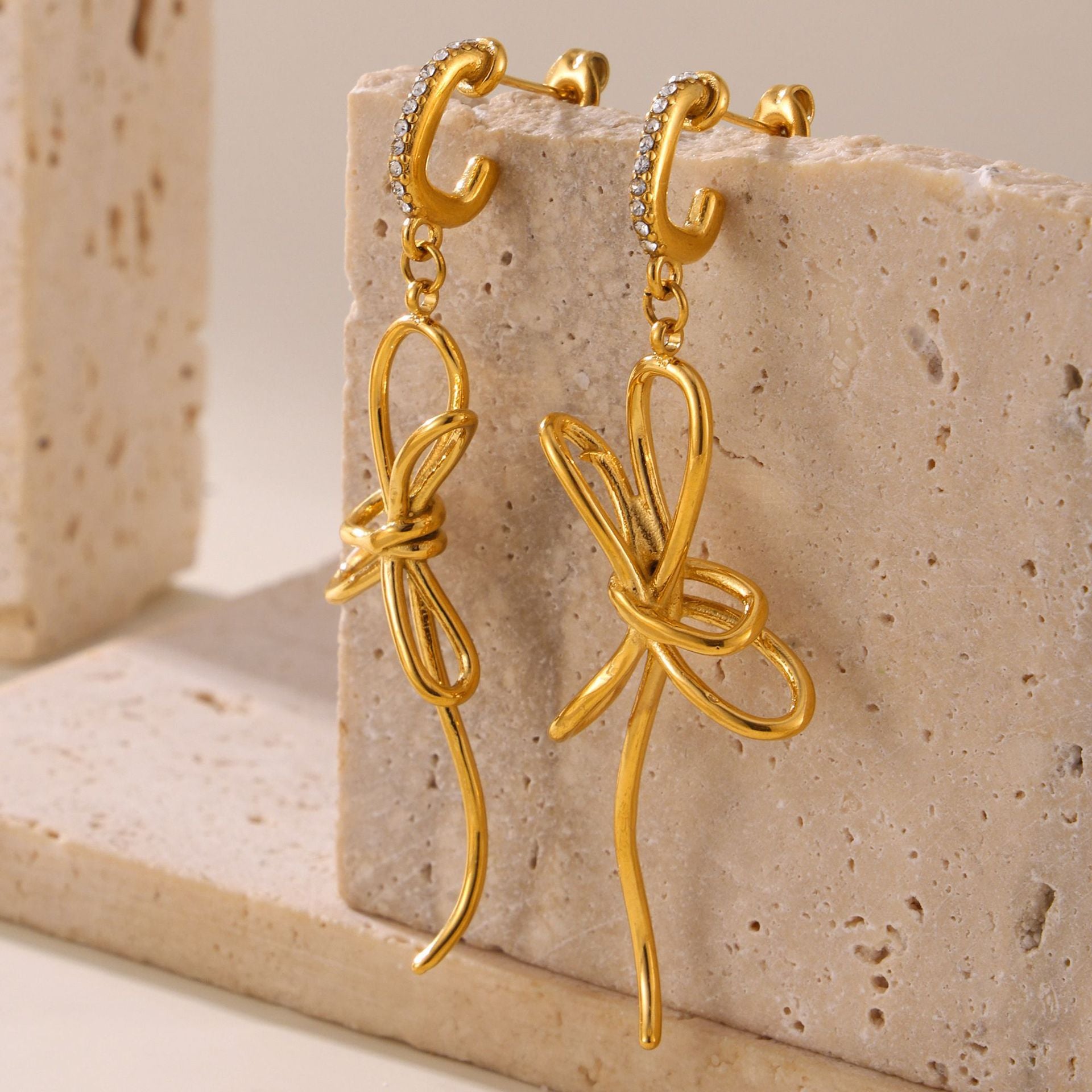 Light luxury bow tassel ribbon stud earrings stainless steel plated 18K real gold fairy earrings spot wholesale