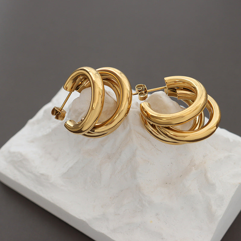 Niche design sense summer accessories personality tide three-layer C-shaped hollow tube titanium steel gold-plated earrings 99