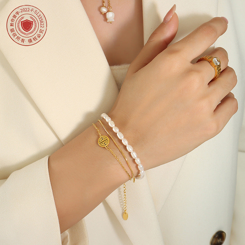 Fashion light luxury personalized three-layer stacked titanium steel hand jewelry natural freshwater pearl lucky bracelet versatile jewelry women