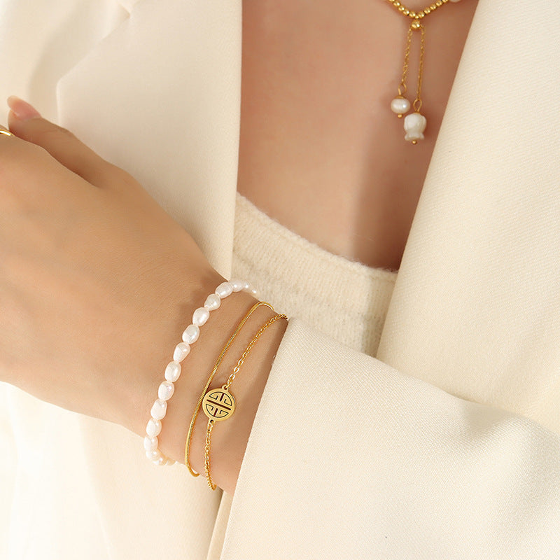 Fashion light luxury personalized three-layer stacked titanium steel hand jewelry natural freshwater pearl lucky bracelet versatile jewelry women