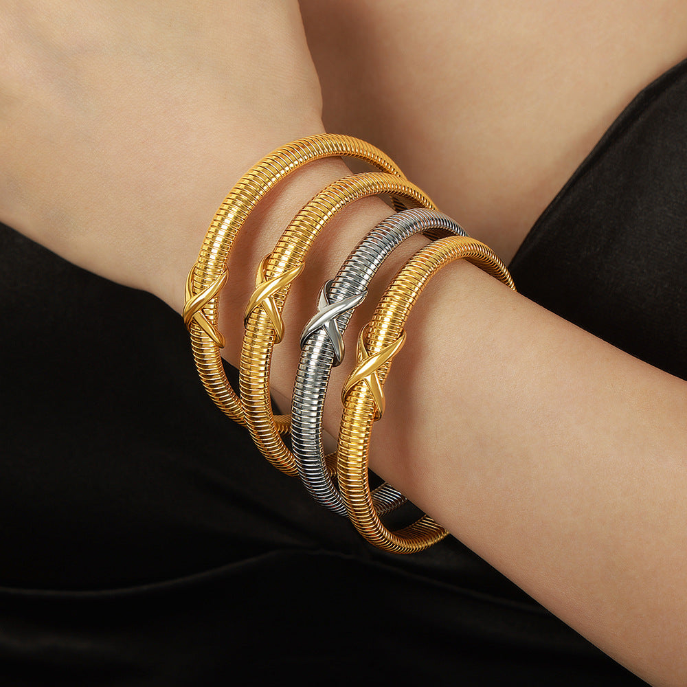 New personalized niche design sense fashionable versatile titanium steel plated 18K gold spring bracelet jewelry wholesale women