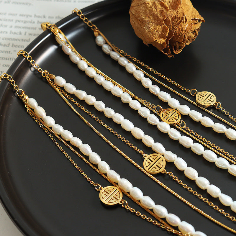 Fashion light luxury personalized three-layer stacked titanium steel hand jewelry natural freshwater pearl lucky bracelet versatile jewelry women
