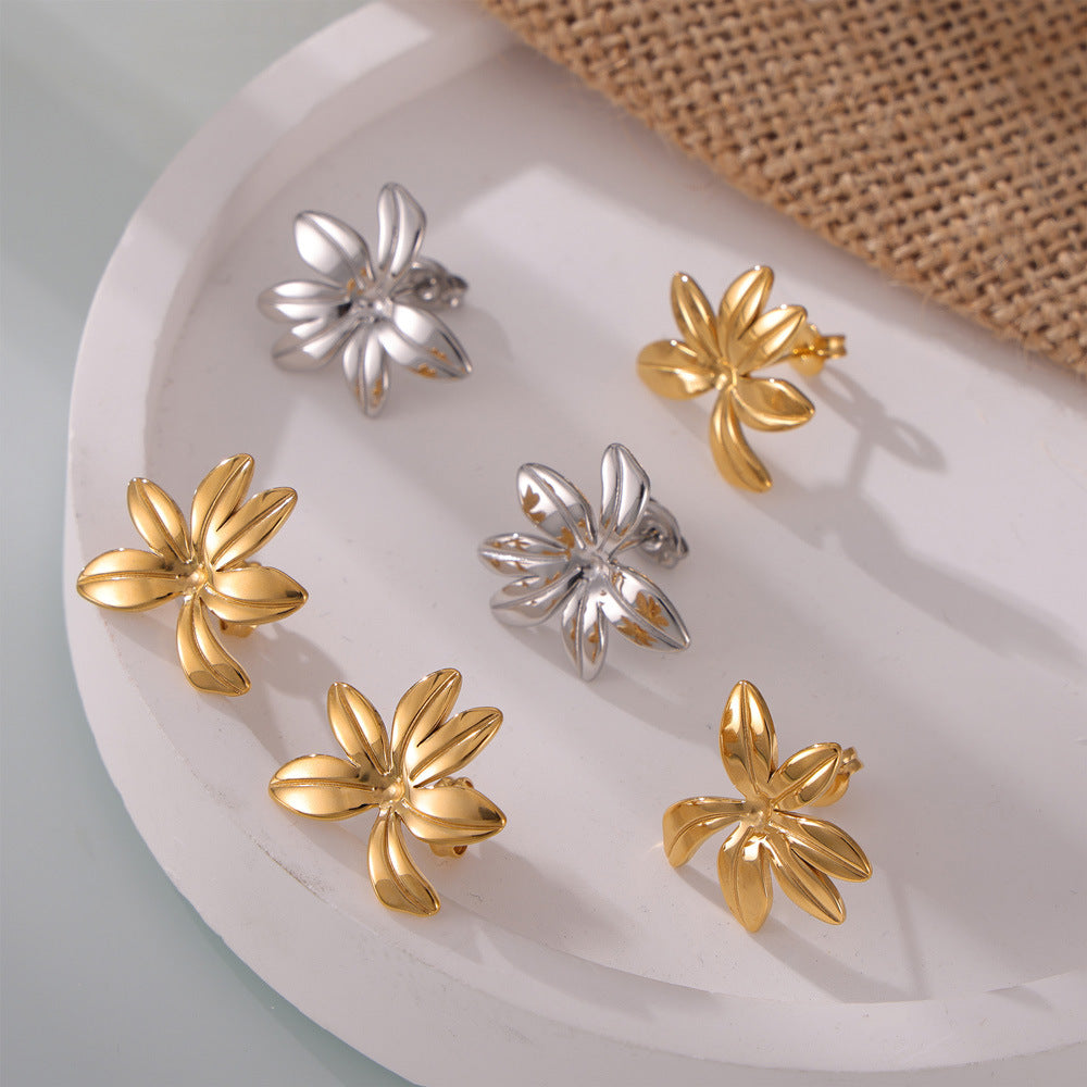 Fresh and simple personality Mori jewelry geometric texture flower design titanium steel gold-plated casual style stud earrings