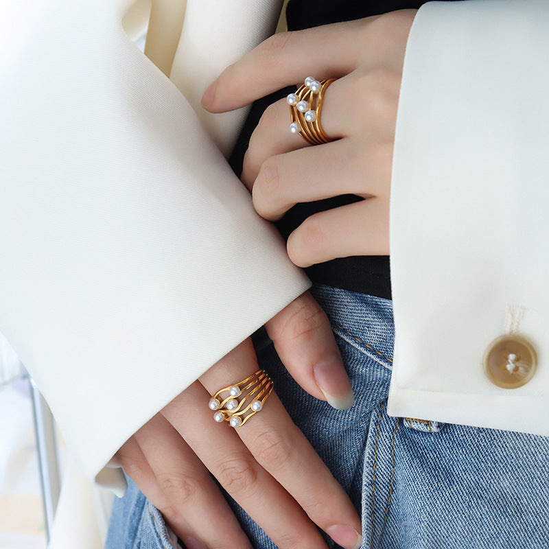 Classical retro corrugated wave imitation pearl ring, simple temperament niche design titanium steel gold-plated jewelry women