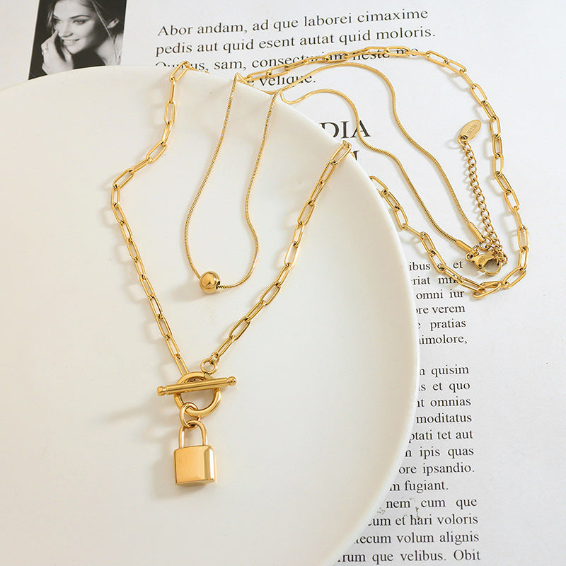 Cold and trendy OT buckle with two locks, steel ball pendant stacked with titanium steel necklace, exquisite women's jewelry 99.