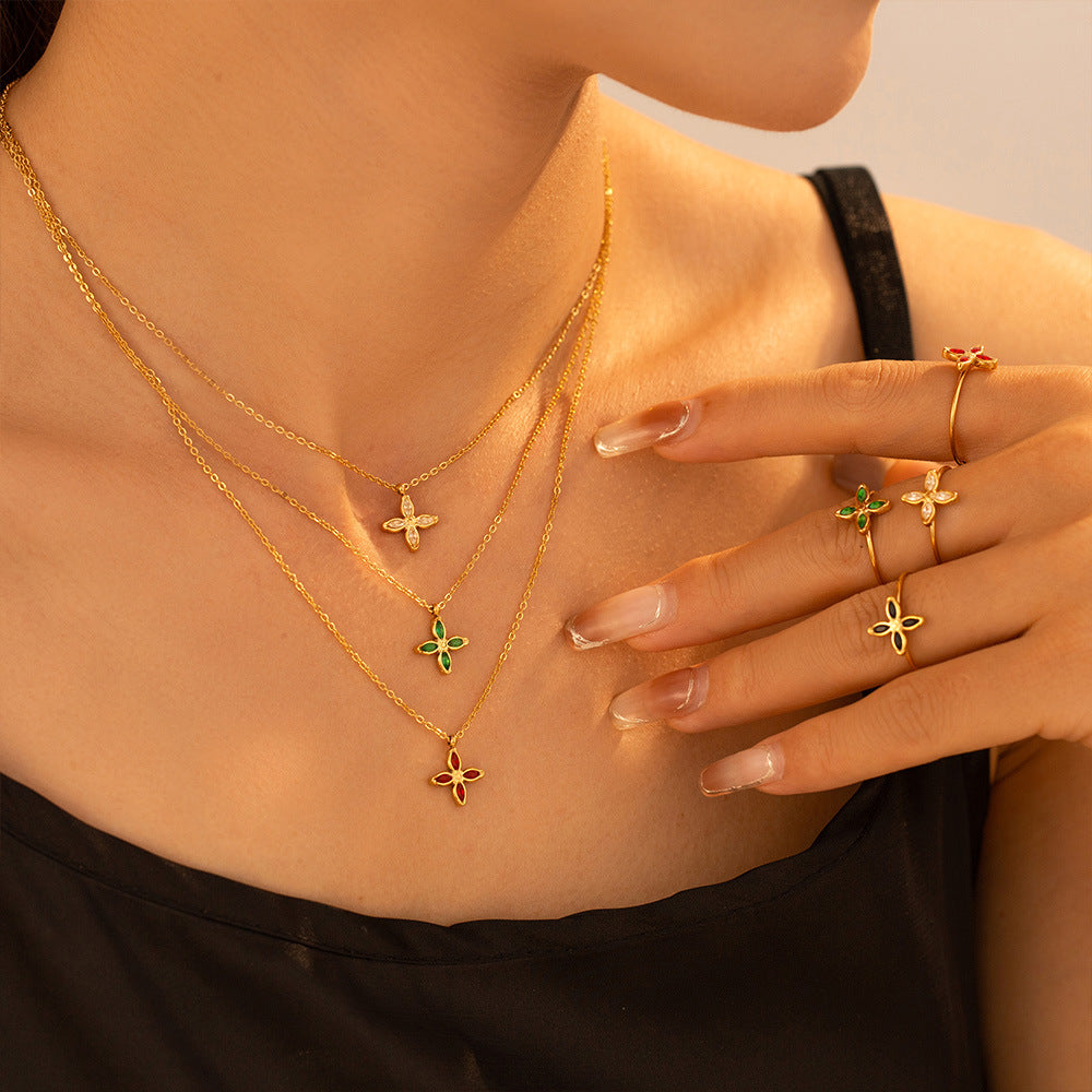 Niche four-petaled flower inlaid zircon pendant, collarbone necklace, open ring, titanium steel plated 18k real gold set, women's 99.