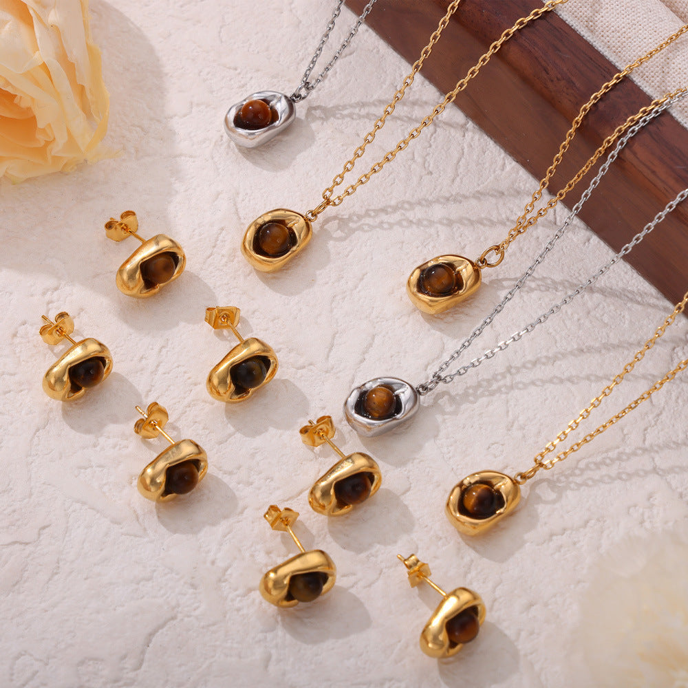 Retro niche jewelry sunken oval brand inlaid tiger's eye design pendant titanium steel jewelry set