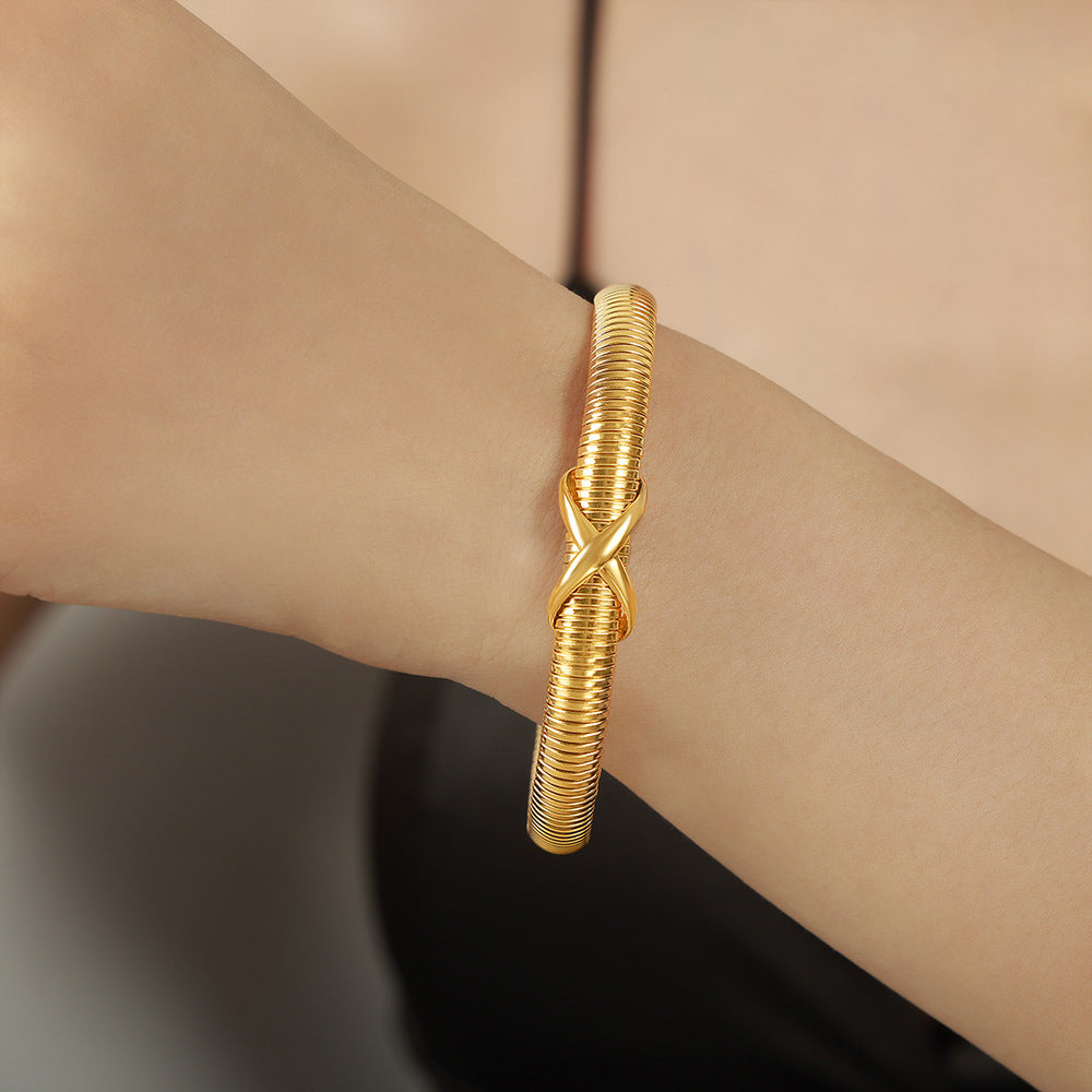 New personalized niche design sense fashionable versatile titanium steel plated 18K gold spring bracelet jewelry wholesale women