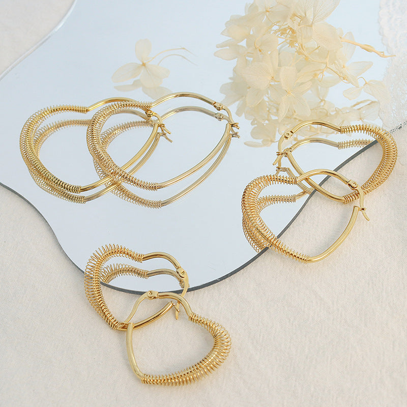Retro style temperament spring peach heart earrings titanium steel plated irregular ear jewelry F259