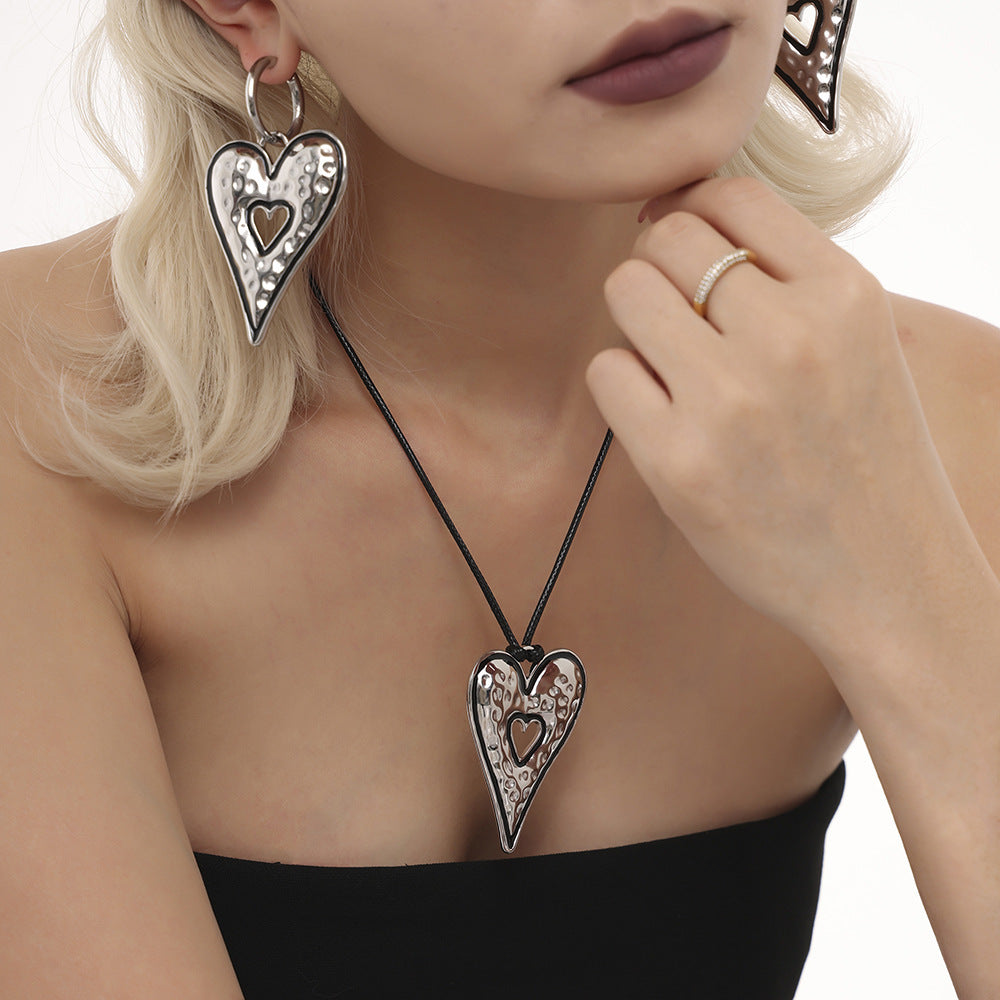 Titanium steel hand-polished large drip love earrings leather rope pull long autumn and winter sweater chain set pp