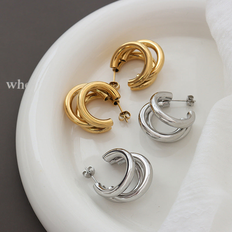 Niche design sense summer accessories personality tide three-layer C-shaped hollow tube titanium steel gold-plated earrings 99