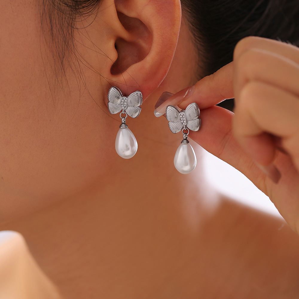 Bow tassel imitation pearl earrings women's niche diamond-set titanium steel-plated 18k gold fashion earrings 99