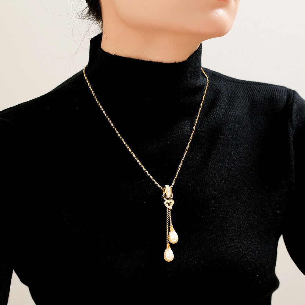European and American light luxury buckle love tassel imitation pearl pendant necklace stainless steel gold-plated stacked necklace jewelry female pp