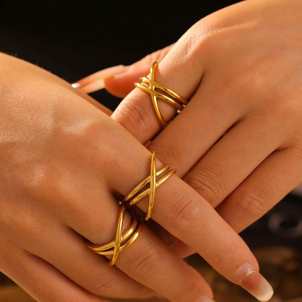 Design sense winding hollow cross line ring, titanium steel electroplated 18k gold ring cold wind hand jewelry pp