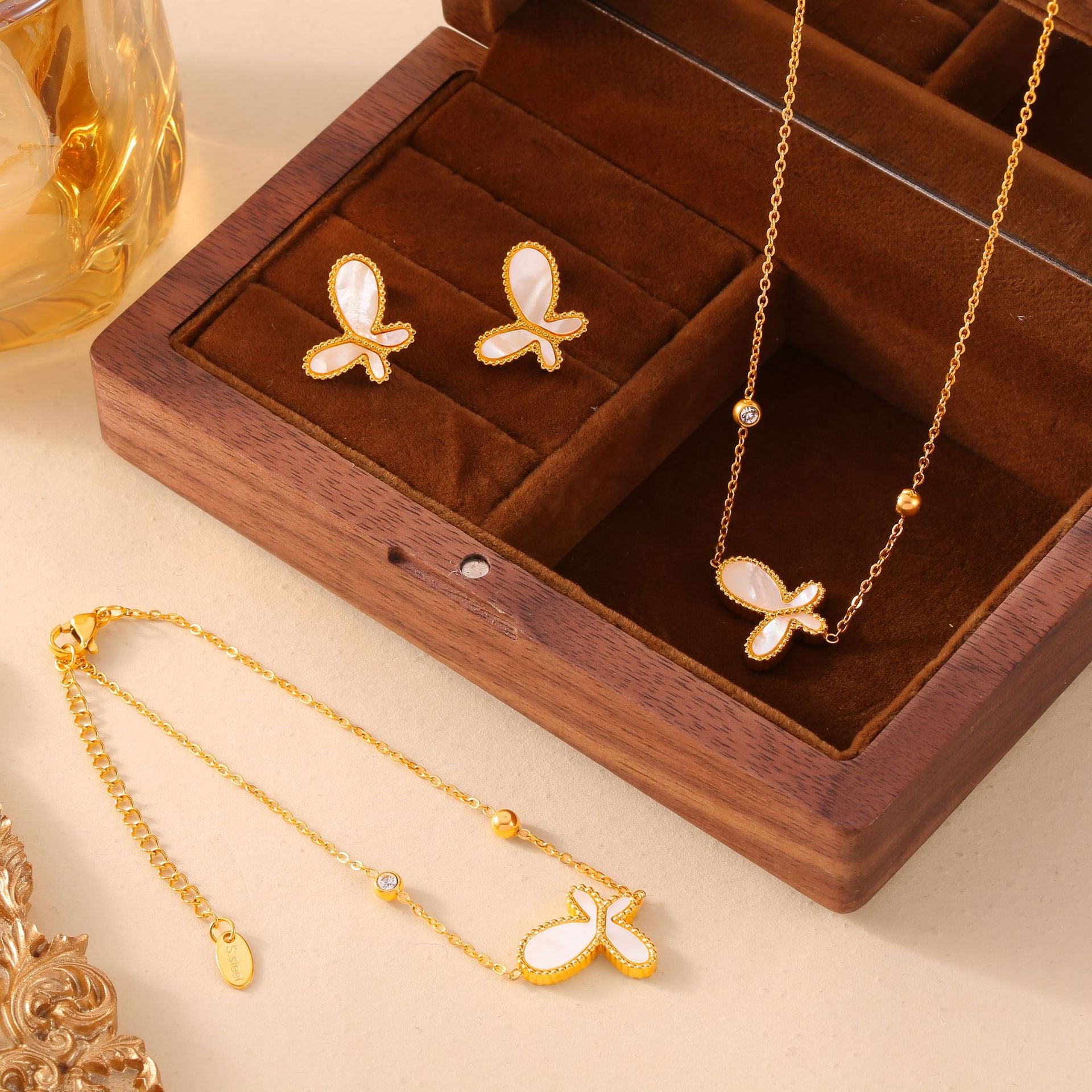 Elegant temperament gentle personality jewelry inlaid with white shell design butterfly pendant titanium steel gold-plated jewelry set