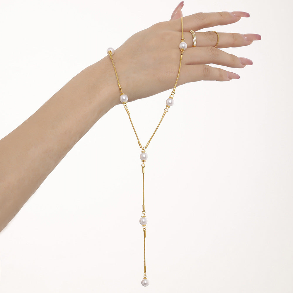 Stainless steel imitation pearl Y character autumn and winter clavicle sweater chain European and American light luxury fringed necklace spot pp