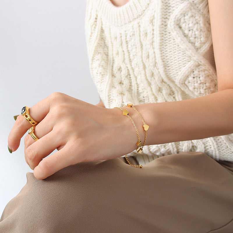 Cold wind light luxury retro trend simple double-layer peach heart titanium steel plated 18 real gold bracelet E054