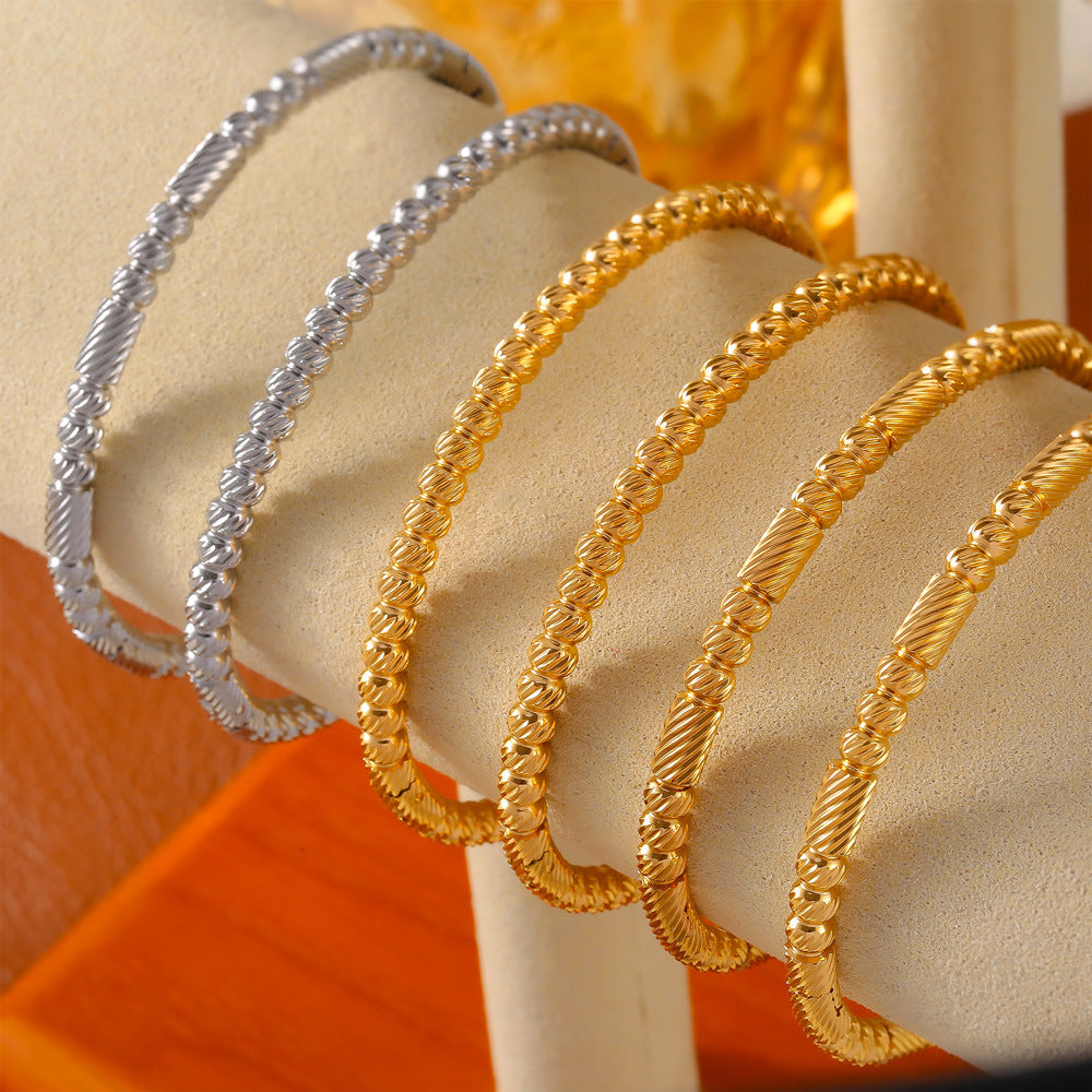 Fashion commuter personality minimalist elegant jewelry geometric texture round bead splicing design titanium steel gold-plated bracelet pp