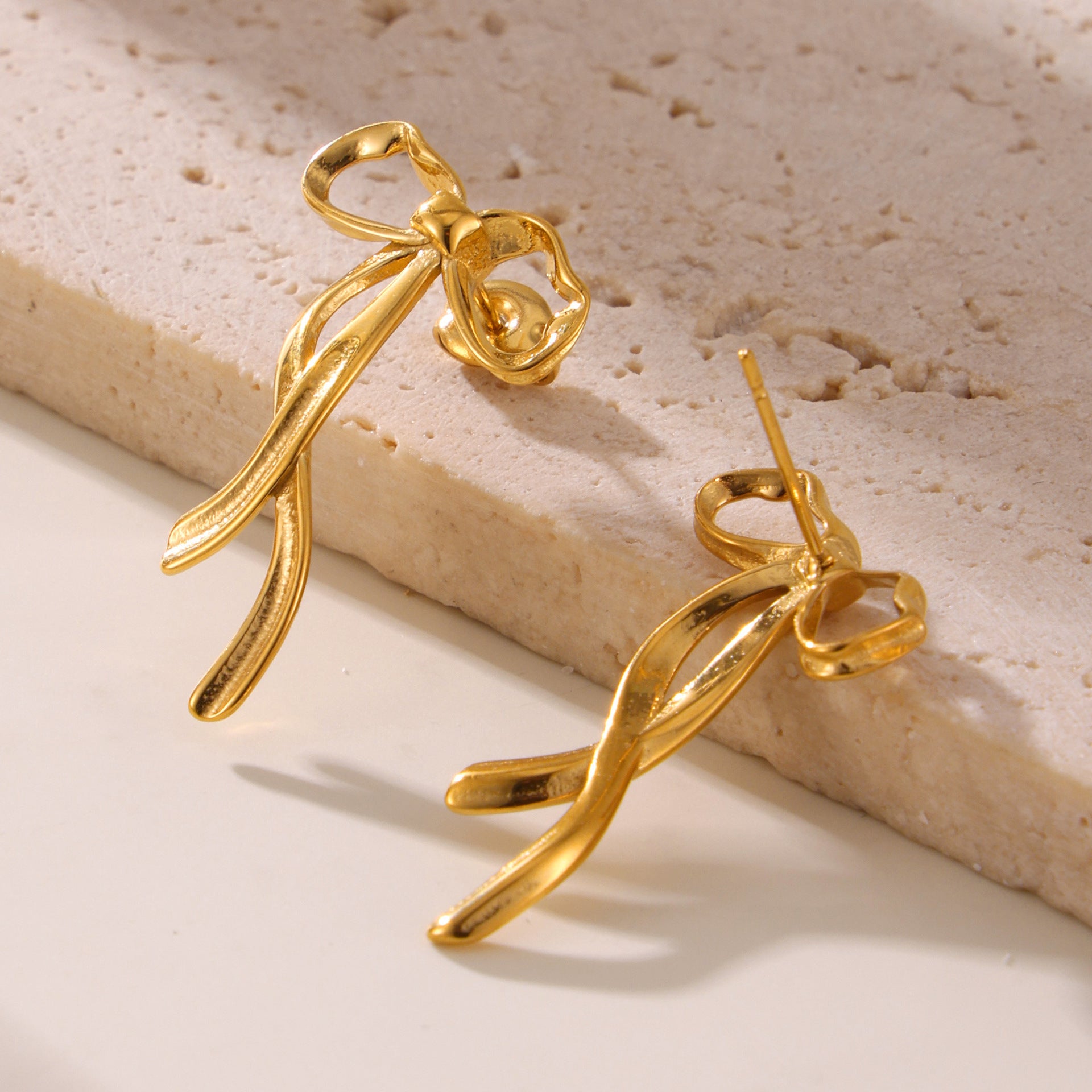 Light luxury bow tassel ribbon stud earrings stainless steel plated 18K real gold fairy earrings spot wholesale