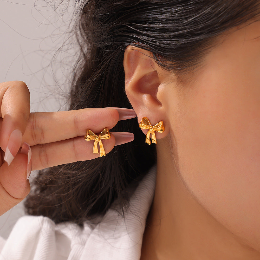 Simple, fresh and elegant, personalized design jewelry, geometric bow shape, titanium steel gold-plated versatile stud earrings