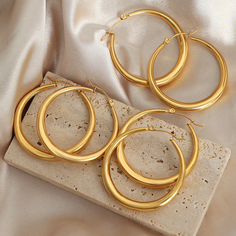 Light luxury high-end earrings, niche design sense, exaggerated temperament, titanium steel gold-plated large circle jewelry women