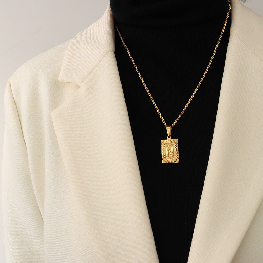 Cold wind niche light luxury retro high-end sense tag necklace titanium steel plated 18K real gold women's jewelry