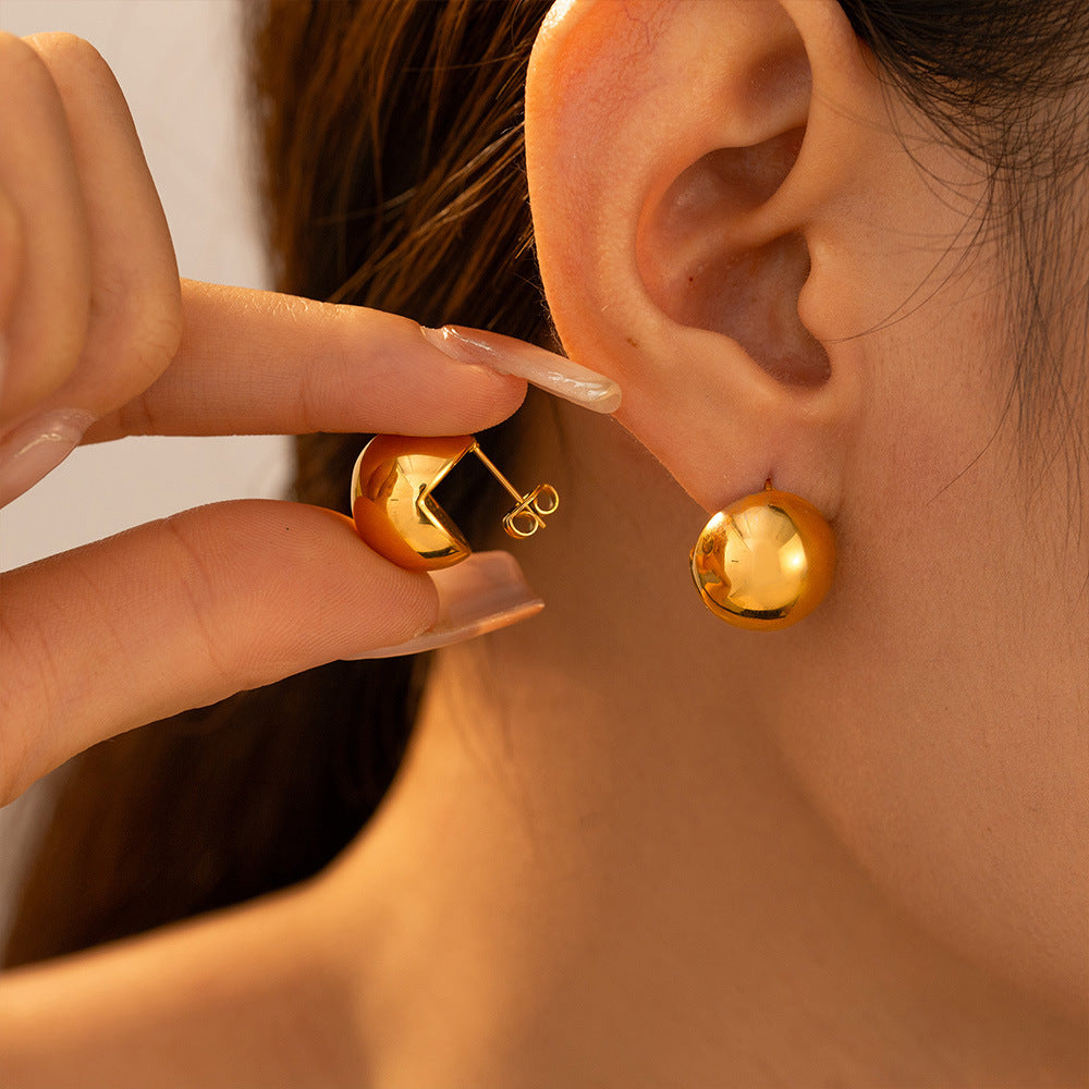 New ball earrings simple and cold wind semicircular hollow earrings autumn and winter light luxury stainless steel jewelry