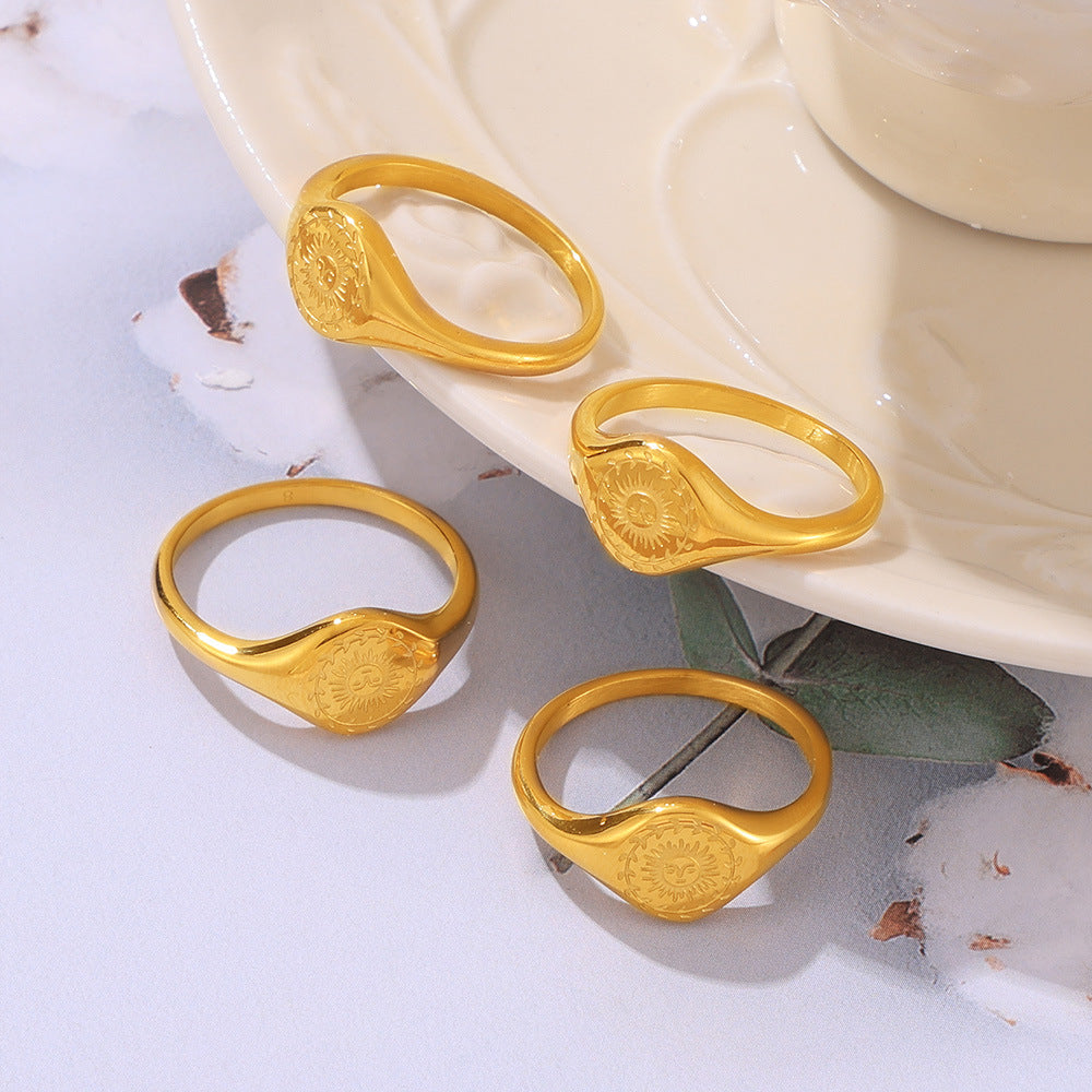 Fashion personality niche cold wind jewelry engraved wreath surrounding the sun design titanium steel gold-plated ring pp