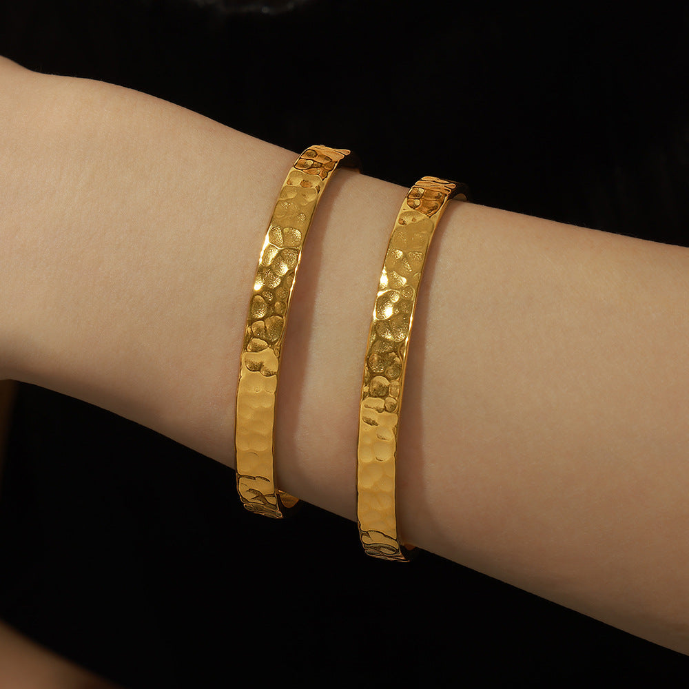 New simple personality niche design titanium steel gold-plated irregular concave-convex hammer surface opening bracelet women's jewelry wholesale 99
