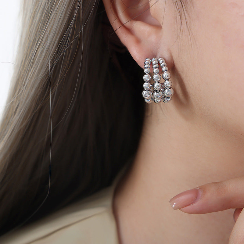 C-shaped semicircular three-layer steel ball splicing niche design metal texture fashionable personalized titanium steel plated K gold earrings