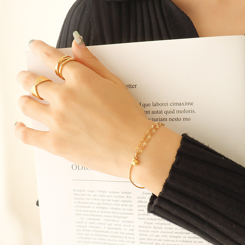 Detailed niche and versatile campus style double-layer lip chain bracelet, small steel ball pendant, titanium steel gold-plated jewelry E15299