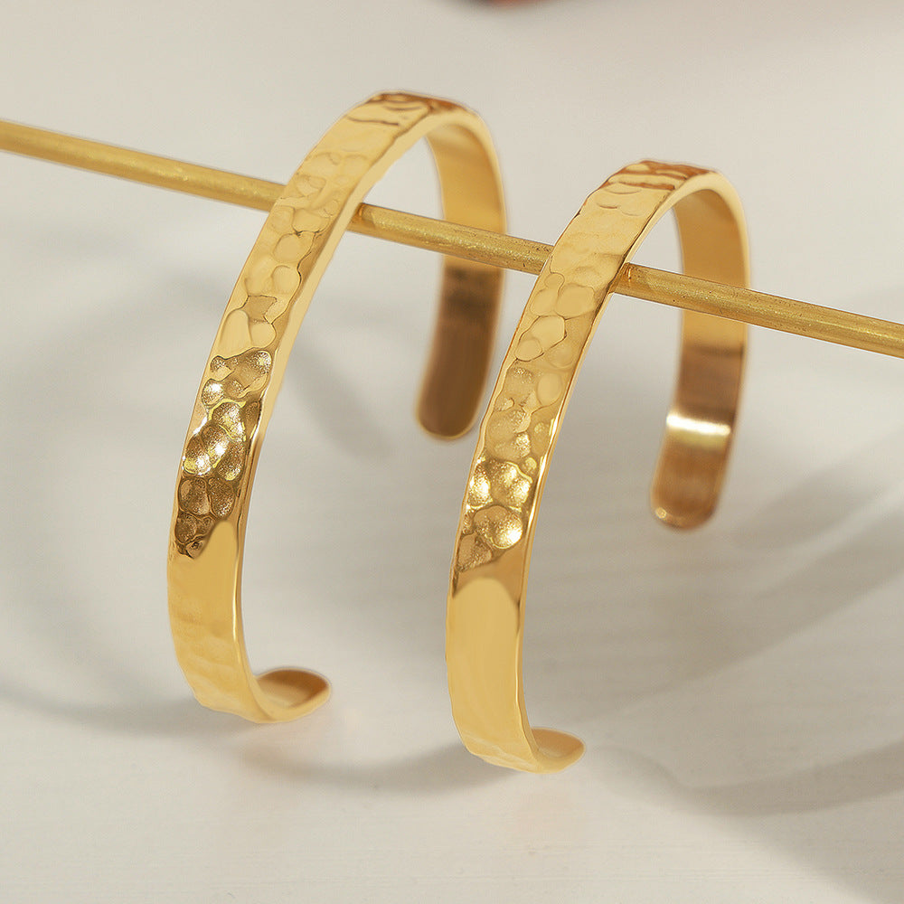 New simple personality niche design titanium steel gold-plated irregular concave-convex hammer surface opening bracelet women's jewelry wholesale 99