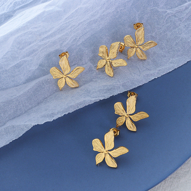 Niche design petal three-dimensional embossed retro earrings titanium steel plated 18k real gold ear jewelry F55199