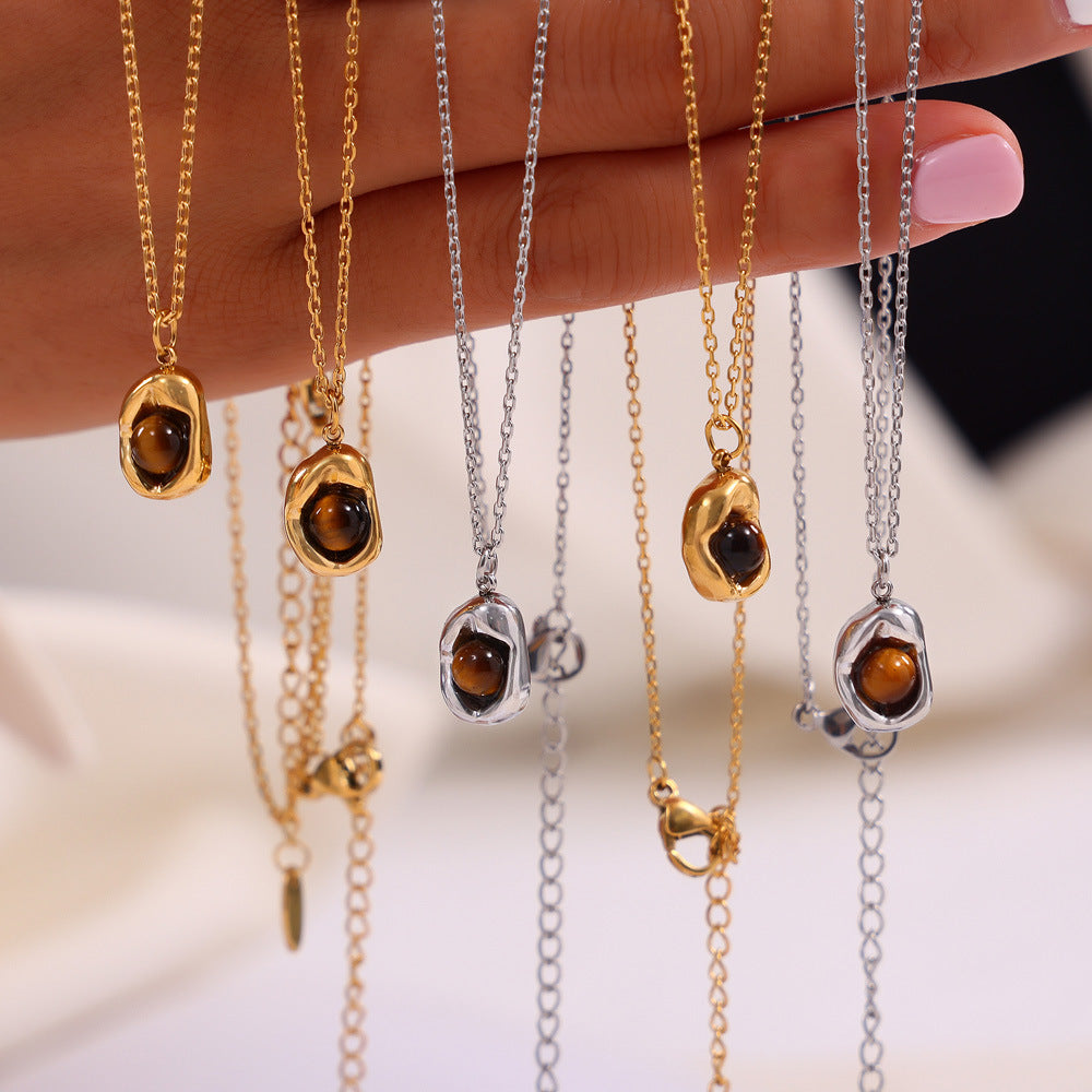 Retro niche jewelry sunken oval brand inlaid tiger's eye design pendant titanium steel jewelry set