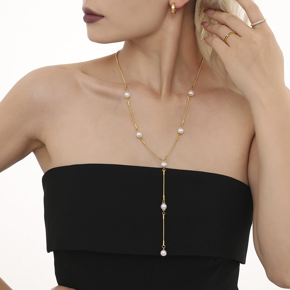 Stainless steel imitation pearl Y character autumn and winter clavicle sweater chain European and American light luxury fringed necklace spot pp