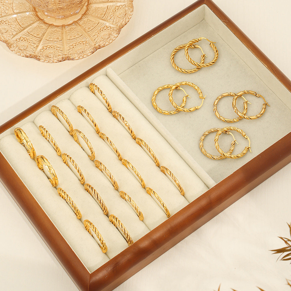 New fashion simple cold wind niche design titanium steel gold-plated twist pattern exaggerated earrings jewelry wholesale 99