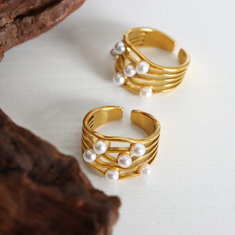 Classical retro corrugated wave imitation pearl ring, simple temperament niche design titanium steel gold-plated jewelry women