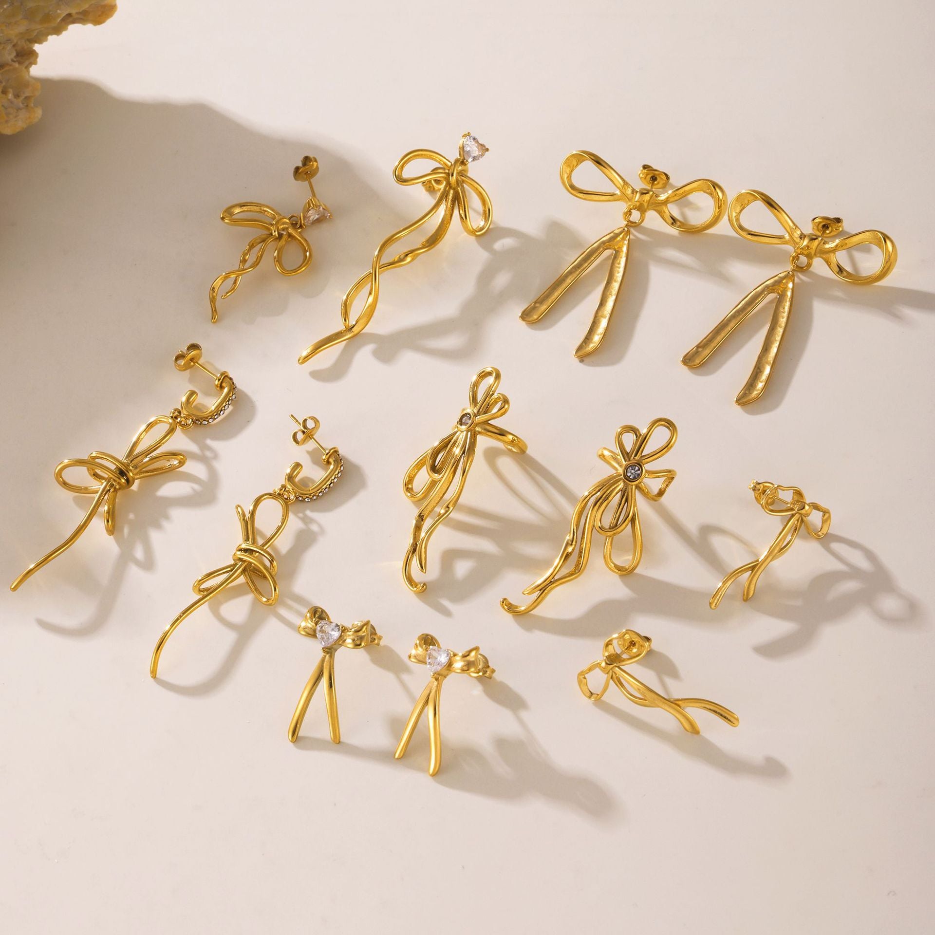 Light luxury bow tassel ribbon stud earrings stainless steel plated 18K real gold fairy earrings spot wholesale