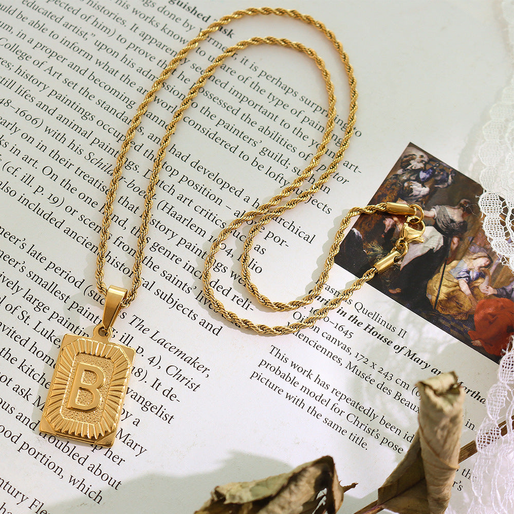 Cold wind niche light luxury retro high-end sense tag necklace titanium steel plated 18K real gold women's jewelry