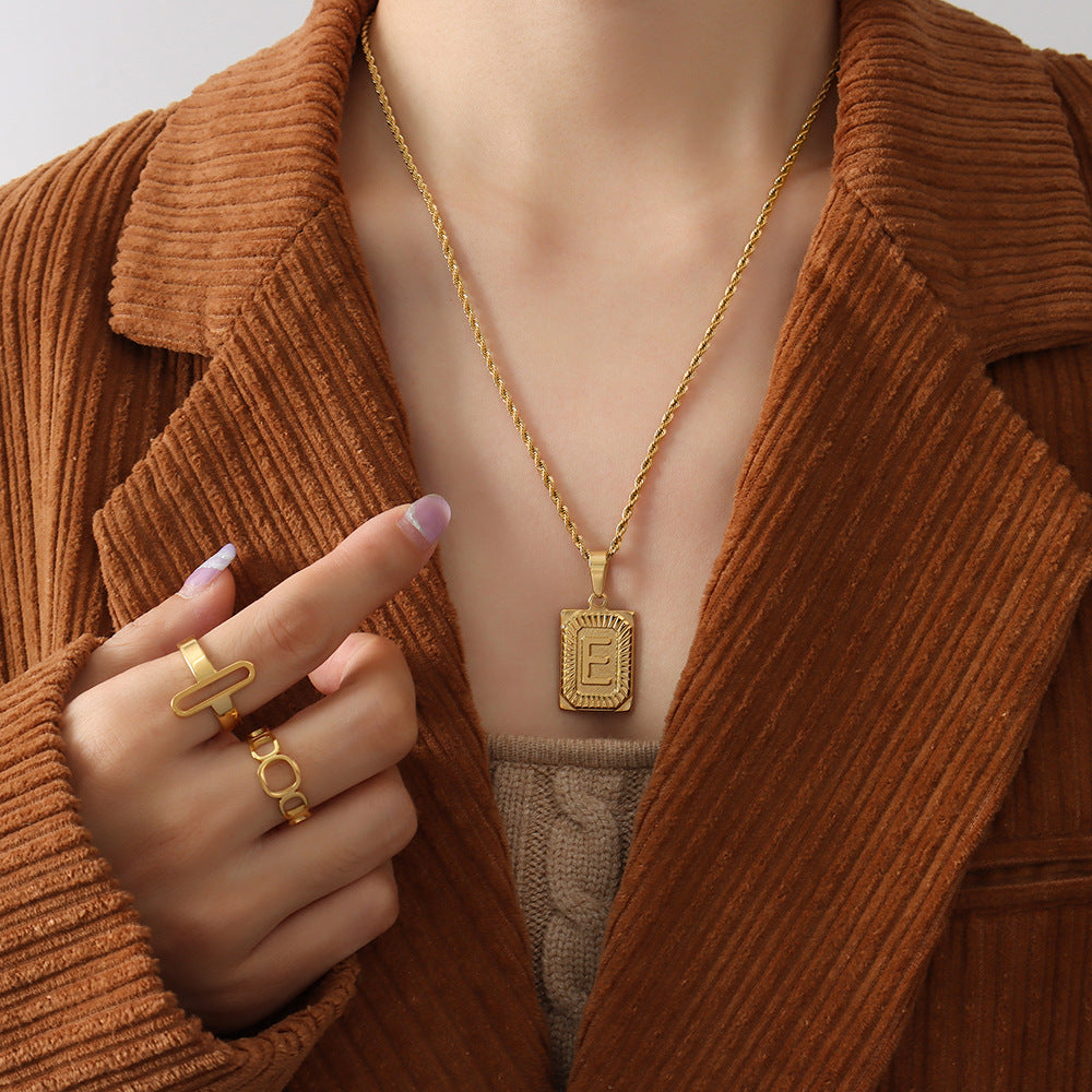 Cold wind niche light luxury retro high-end sense tag necklace titanium steel plated 18K real gold women's jewelry