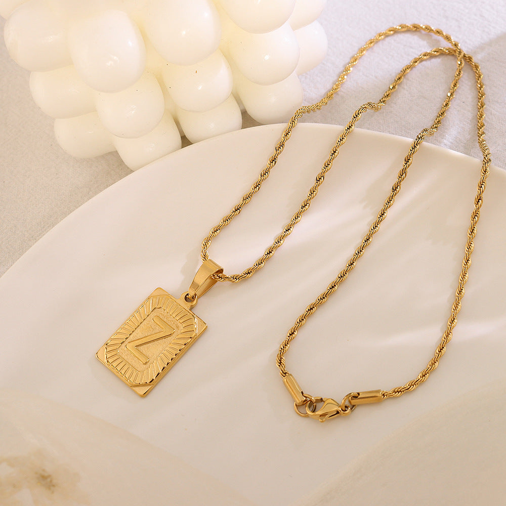 Cold wind niche light luxury retro high-end sense tag necklace titanium steel plated 18K real gold women's jewelry