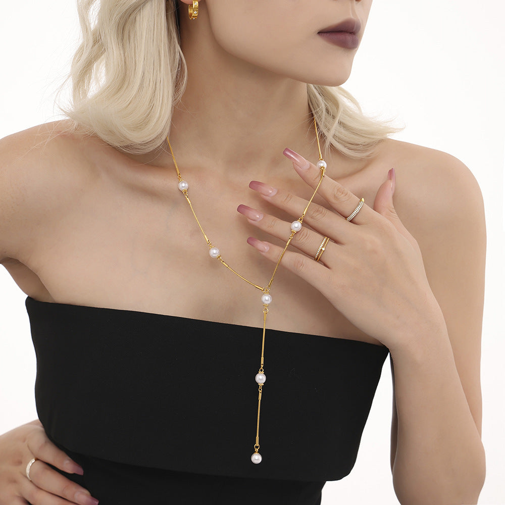 Stainless steel imitation pearl Y character autumn and winter clavicle sweater chain European and American light luxury fringed necklace spot pp