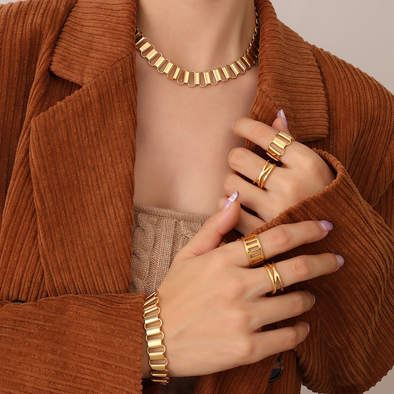 Cold wind light luxury hollow geometric ring necklace bracelet combination titanium steel plated 18K real gold set