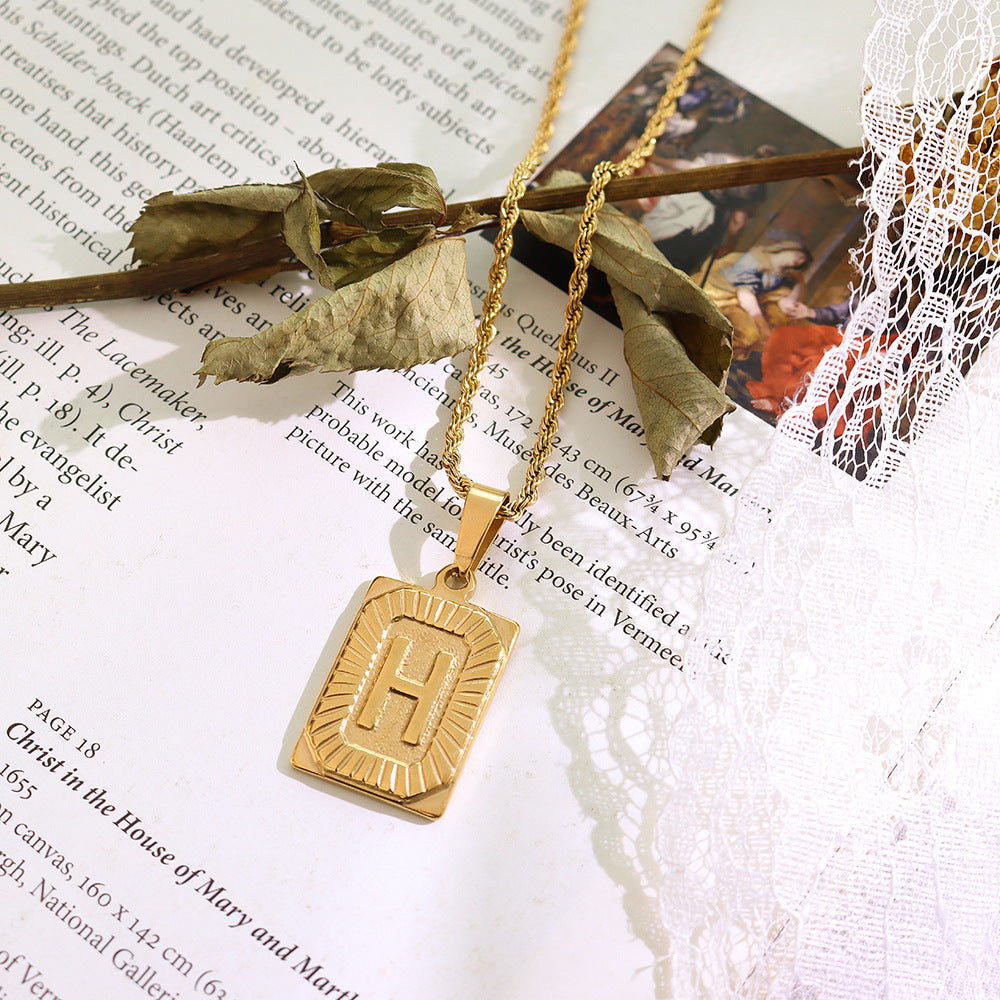 Cold wind niche light luxury retro high-end sense tag necklace titanium steel plated 18K real gold women's jewelry