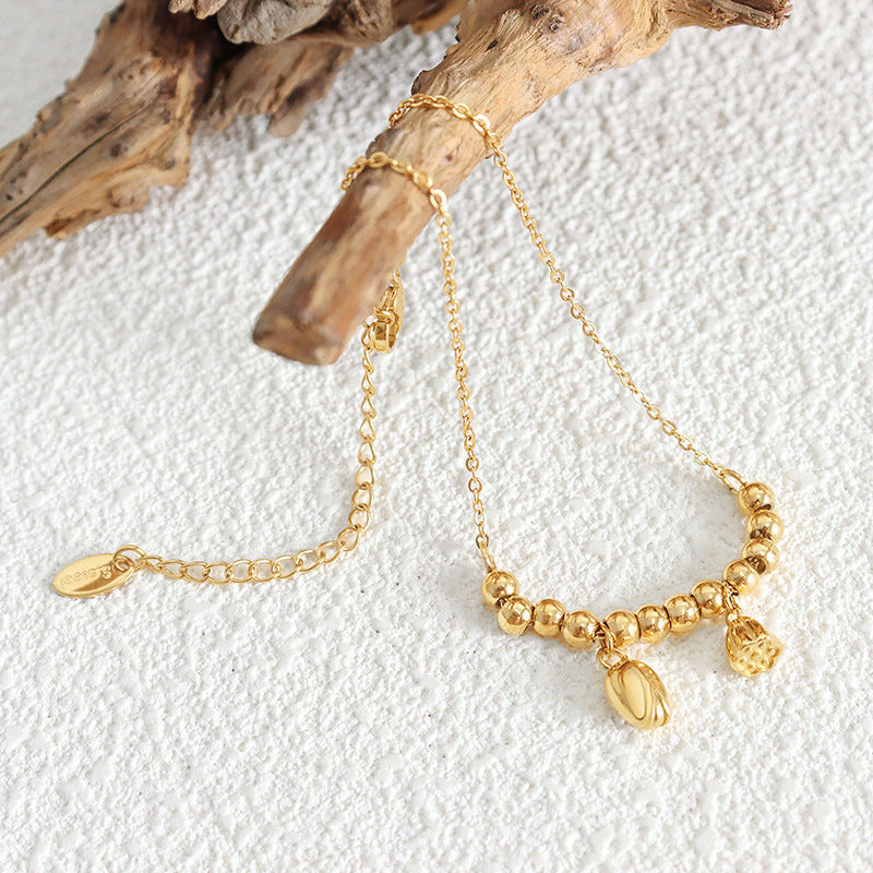 Hot-selling personalized fashion lotus pod lotus pendant titanium steel beaded anklet plated with 18k gold foot jewelry women's jewelry